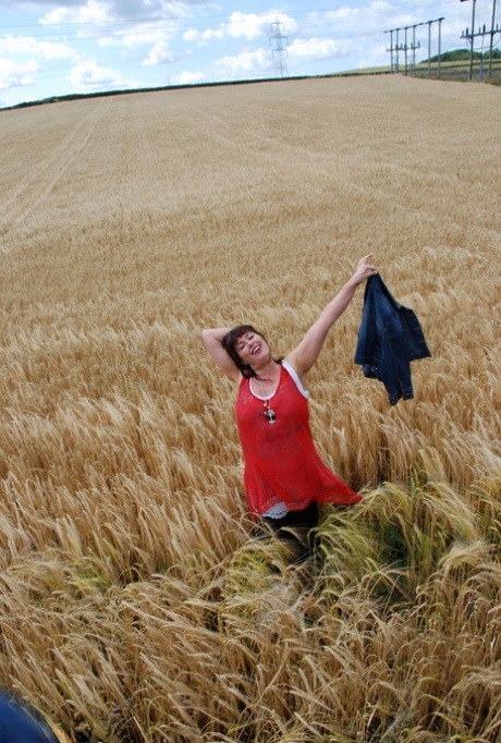 Older British amateur Juicey Janey shows her tits and twat in a field of wheat 31471726