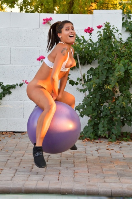 Fit amateur Sommer rides a bouncy dildo ball after exercising on a patio