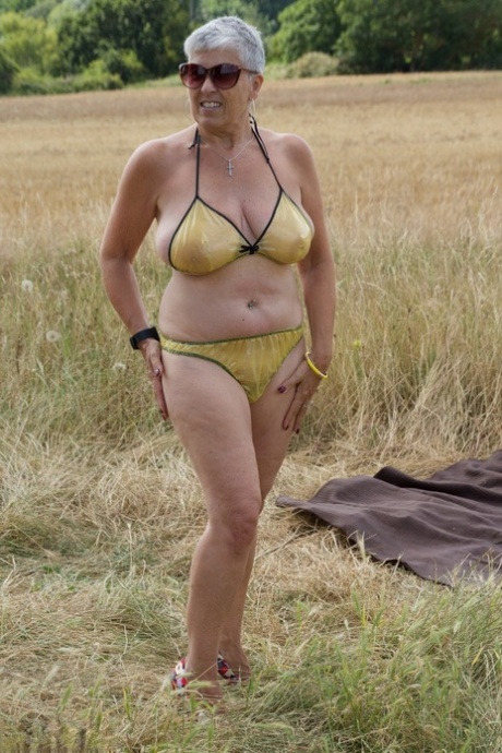 Old lesbians catch rays on their large breasts while sunbathing in a field 11846651