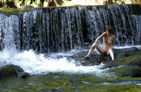 Solo girl Liana takes off her swimwear to go nude in front of a waterfall 47690130