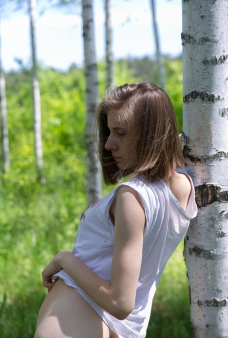 Skinny 18-year-old Anna R grabs her tight ass and snatch against a birch tree 63723432