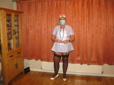 Fat nurse Chrissy Uk removes a surgical mask and uniform to model lingerie 85862701
