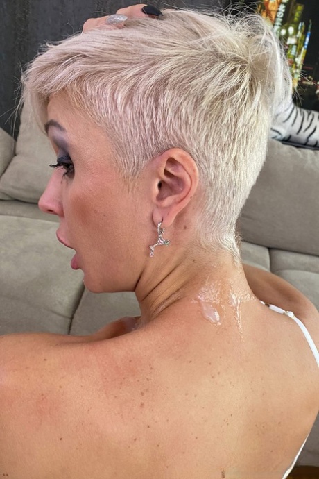 Inked platinum blonde Tanya Virago holds a cock after showing her pierced cunt 37924613