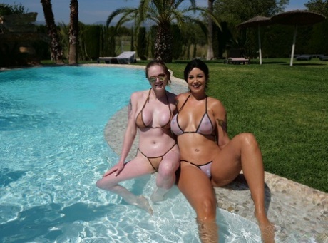 Ibi Smiles & Carly Rae model bikinis during a poolside shoot 81822503
