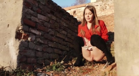 Caucasian girl Nastya takes a piss behind the remnants of a brick house 90188537