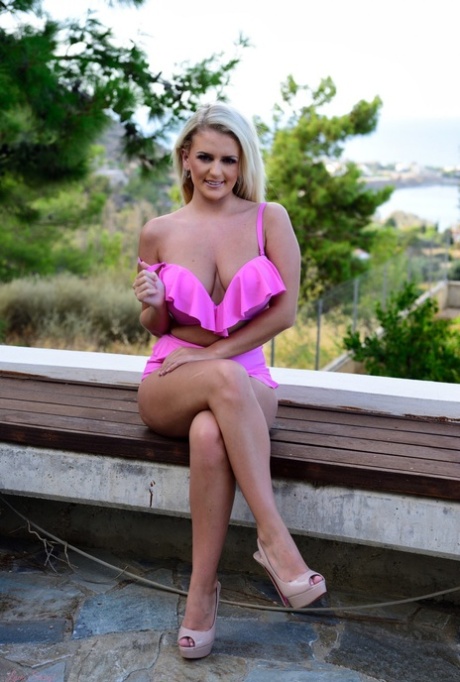 Busty blonde Lycia Sharyl gets naked in red-soled heels on a patio 71838301