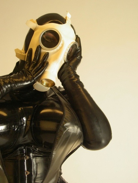 Solo model Darkwing Zero sports a gas mask while modelling latex clothing 10346764