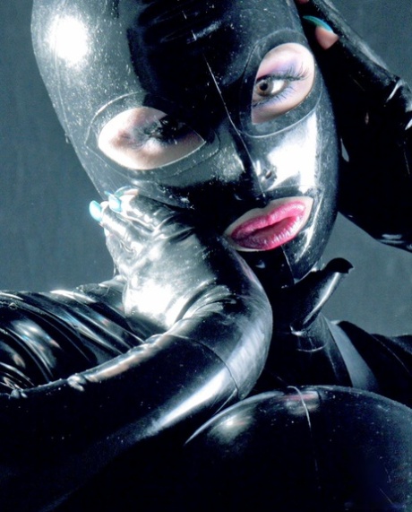 Fetish model Darkwing Zero poses in a big boobed latex outfit 33274766
