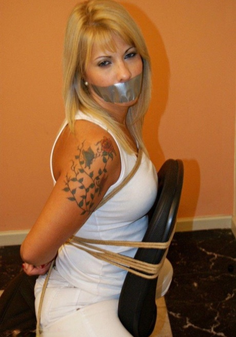 Blonde amateur is silenced with duct tape while tied to a desk chair 92189068
