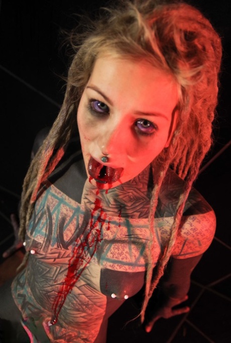 Totally tattooed girl Anuskatzz spits out blood after having her tongue split 98471940