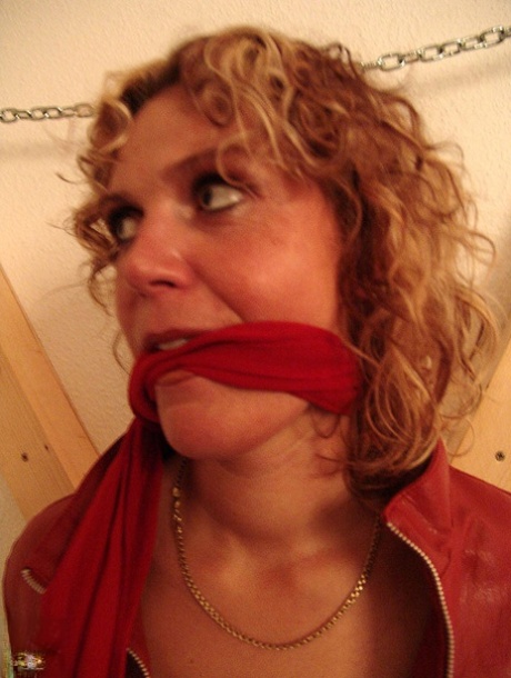 Clothed woman Blonde Lea sports curly hair while being tied up & cleave gagged 86716239
