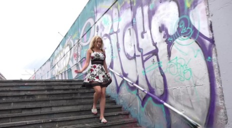 Blonde girl Emily Bright takes a piss on steps after being caught short 97126279