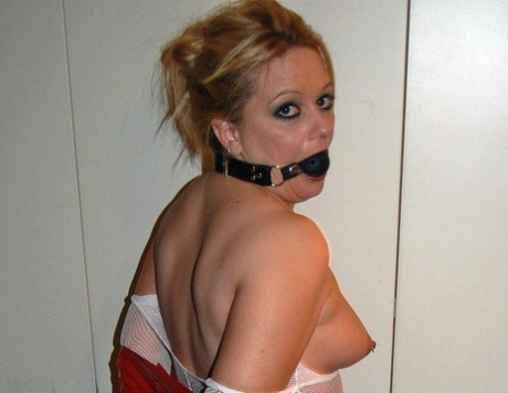 Amateur model sports a ball gag while restrained in a crotchless stocking 58188411