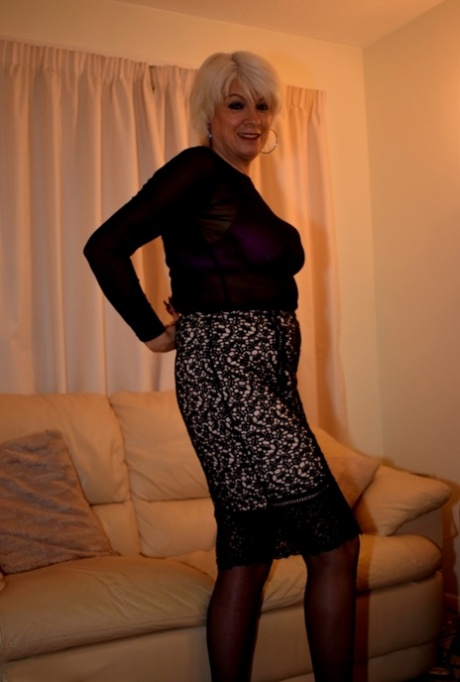 Mature blonde strips to her underwear and stockings over a glass of wine 70158816