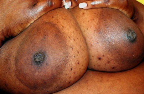 Ebony SSBBW Ms Alotoftitties sets her massive titties loose on a chair 93516883