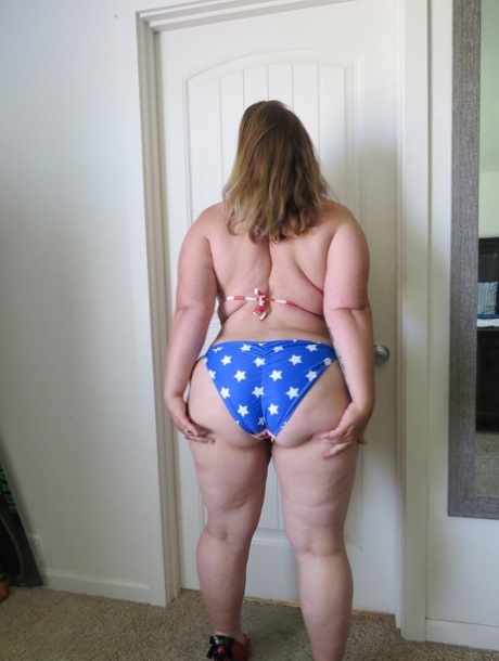 Fat amateur Busty Kris Ann licks a nipple after removing her bikini 20351521