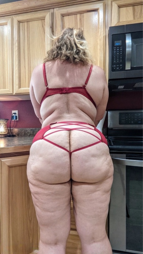 Amateur woman Busty Kris Ann shows her big tits and butt in her kitchen 27545598