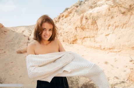 Sweet teen Keira Blue poses completely naked in an arid setting 27371230