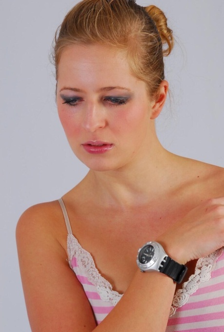 Amateur model Anna displays her Swatch Scuba watch while fully clothed 19993646