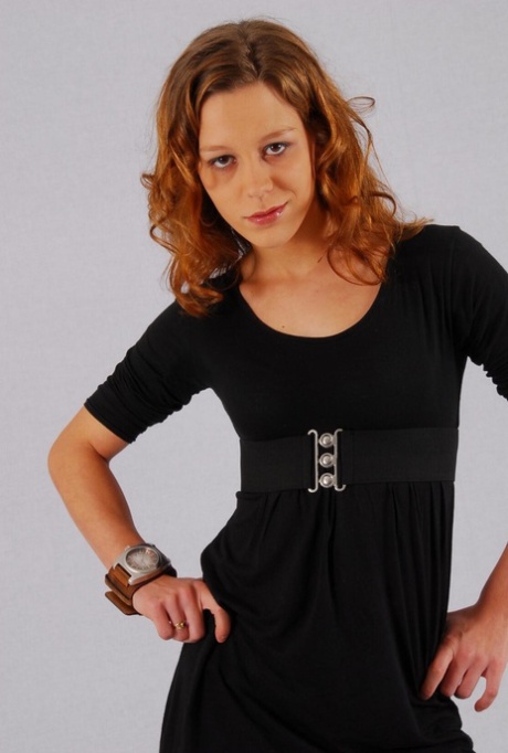 Natural redhead Sabine shows off her OOZOO cuff watch while fully clothed