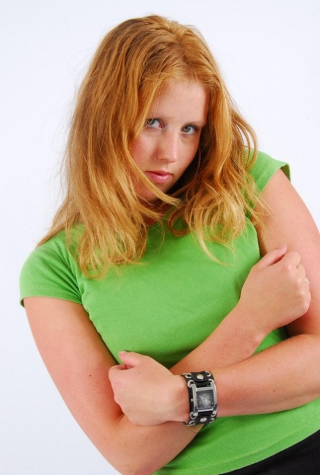 Natural redhead Judy models a double buckle cuff watch during SFW action 36196888
