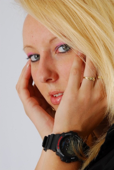 Blue-eyed blonde Britt displays her black G-Shock during non-nude action 66826694