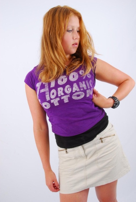 Natural redhead Judy models a black G-Shock watch while fully clothed 70357395
