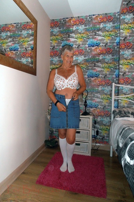 Silver haired granny Savana strips down to white knee socks in her bedroom 82259866