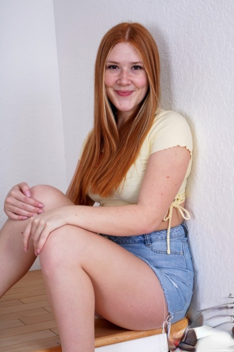 Young redhead Harper Red gets naked on the stairs while wearing sandals 59035347