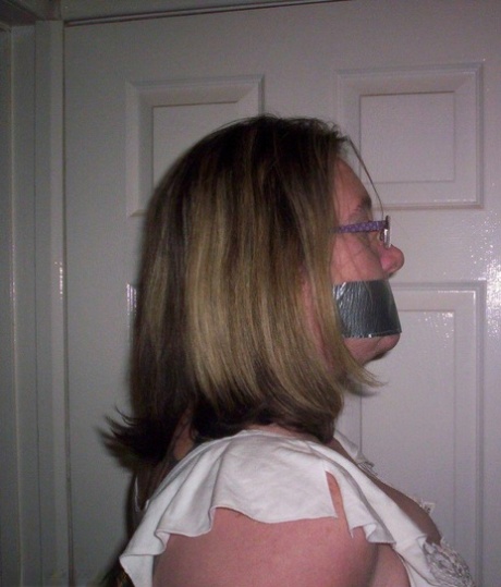 Caucasian female shows her natural tits while gagged and rope bound 23101492
