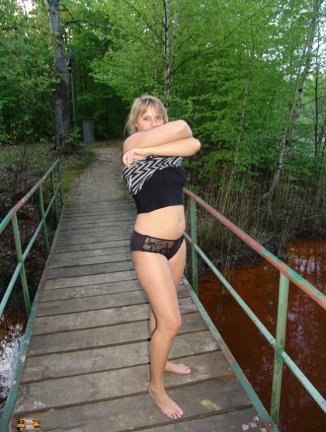 Middle-aged blonde Sweet Susi gets bare naked during a walk thru a nature park 66643426