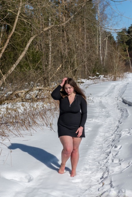 BBW solo girl is ball gagged and bound on snow-covered ground in the nude 51410777