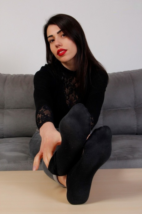 Beautiful girl with red lips Petra frees her pretty feet from socks and shoes 22295183