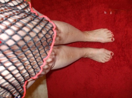 Older amateur Busty Bliss sports painted toenails while modelling lingerie 66131348