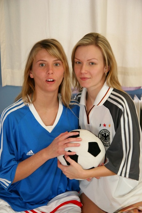 Cute teen girls go lesbian after trying on soccer outfits on a bed 82757609