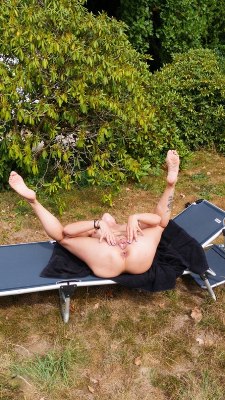 Horny woman masturbates on a backyard lounge chair while alone 20097896