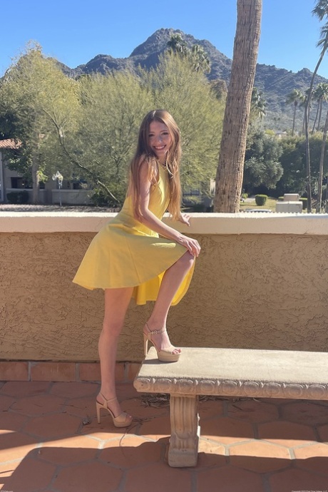 First timer flashes her naked body underneath clear skies in a yellow dress 25886625