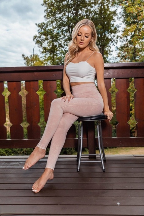 Blonde MILF Serenity releases her great body from clothing out on a deck 88278261