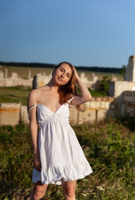 Beautiful teen Lana Winter gets completely naked at the remains of a building 94630256