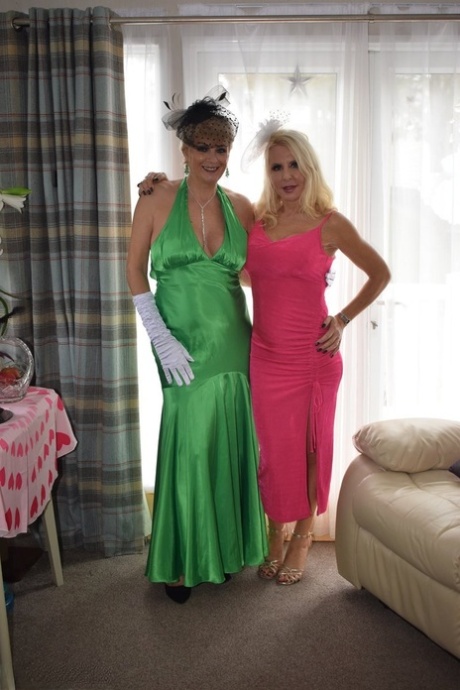 Mature lesbians Emerald and Dimonty partake in foreplay while dolled up 96433309