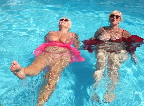 Older blonde fatty Melody engages in lesbian play in a swimming pool 53307431