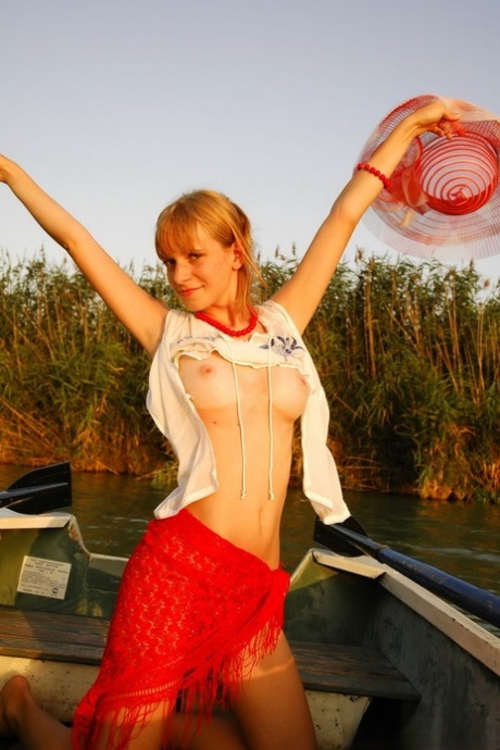 18-year-old girl Inna unveils her hot body while on a rowboat