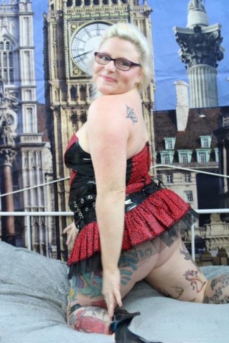 Overweight UK blonde Mollie Foxxx pops her boobs out of a dress in heels 65551850