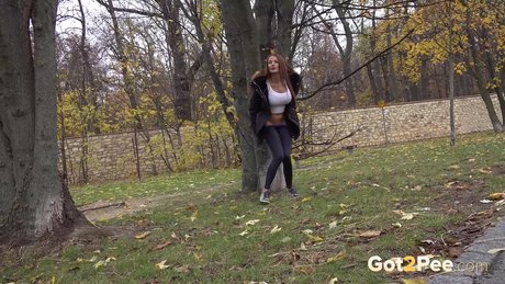Caucasian girl Maddi Black takes a piss up against a tree in a park 48376791