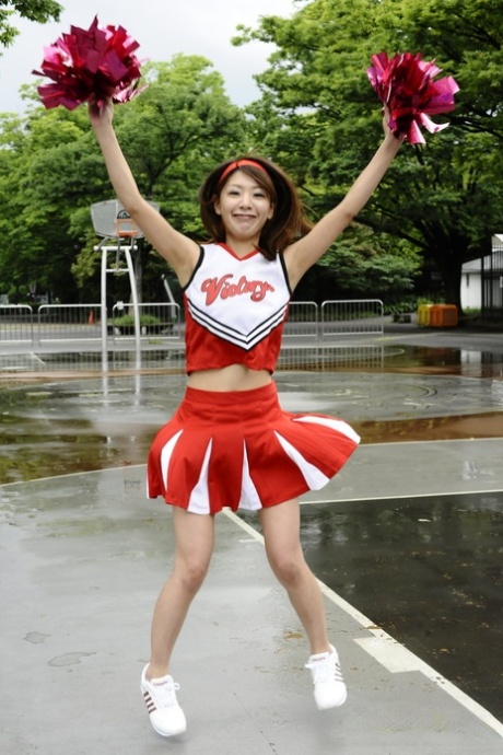 Japanese cheerleader Tomomi Matsuda gives a demonstration at a playground