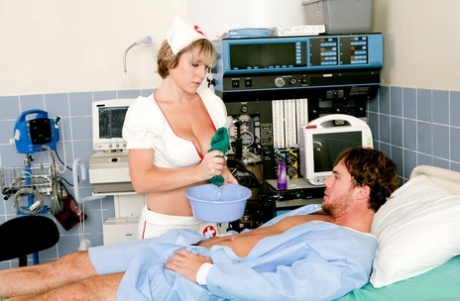 Sexy nurse Velicity Von displays her cleavage while giving a sponge bath 47177867