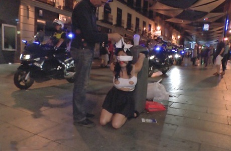 Dark-haired girl is subjected to breath play before being fucked in public