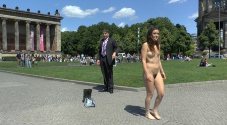 Caucasian girl strolls naked through a square before having sex in public 72449711