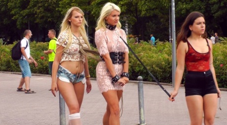 Blonde slaves are paraded in public before outdoor blowjobs and public fucking 10076425