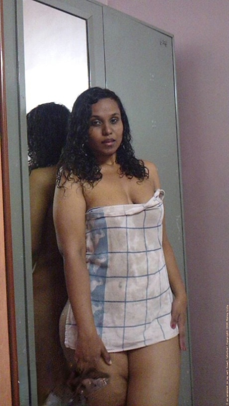 Indian plumper Lily Singh shows her bare ass and natural tits afore a mirror 37560110